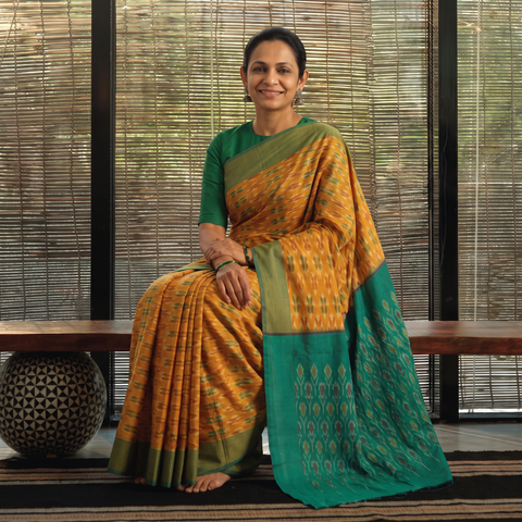 Orange Pochampally Ikat Weave Mercerised Cotton Saree, draped and worn by a woman, AI visual of the saree, iTokri