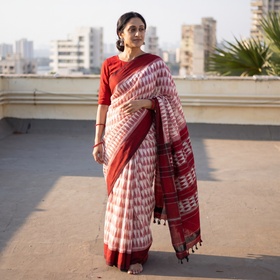 Maroon Pochampally Ikat Weave Pure Handloom Cotton Saree, draped and worn by a woman, AI visual of the saree, iTokri