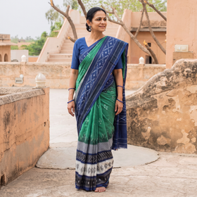 Green Pochampally Ikat Weave Pure Handloom Cotton Saree, draped and worn by a woman, AI visual of the saree, iTokri