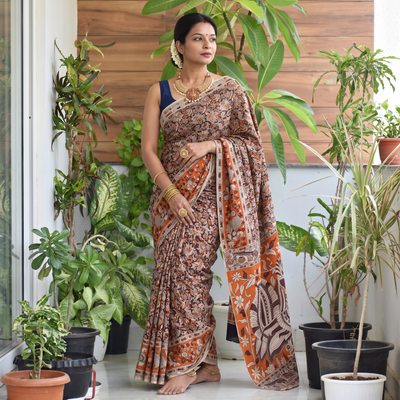 Brown Printed Cotton Kalamkari Saree, draped and worn by a woman, AI visual of the saree, iTokri