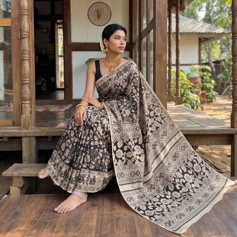 Black Printed Cotton Kalamkari Saree, draped and worn by a woman, AI visual of the saree, iTokri
