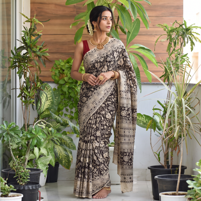 Black Printed Cotton Kalamkari Saree, draped and worn by a woman, AI visual of the saree, iTokri