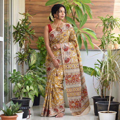 Yellow Printed Cotton Kalamkari Saree, draped and worn by a woman, AI visual of the saree, iTokri
