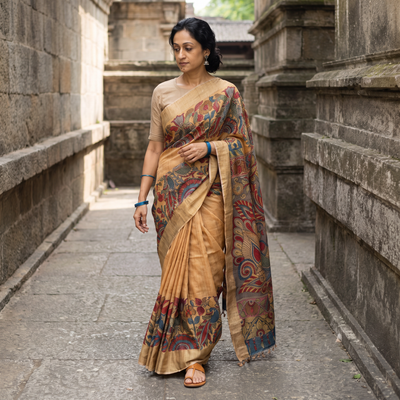 Beige Pure Handloom Desi Tussar Silk Handpainted Srikalahasti Pen Kalamkari Saree with Zari Border, draped and worn by a woman, AI visual of the saree, iTokri
