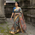 Blue Pure Handloom Desi Tussar Silk Handpainted Srikalahasti Pen Kalamkari Saree with Zari Border, draped and worn by a woman, AI visual of the saree, iTokri
