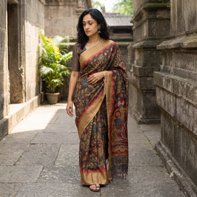 Brown Pure Handloom Desi Tussar Silk Handpainted Srikalahasti Pen Kalamkari Saree with Zari Border, draped and worn by a woman, AI visual of the saree, iTokri