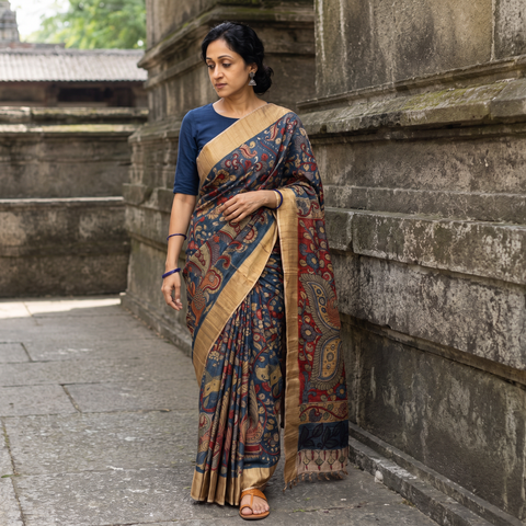 Blue Pure Handloom Desi Tussar Silk Handpainted Srikalahasti Pen Kalamkari Saree with Zari Border, draped and worn by a woman, AI visual of the saree, iTokri