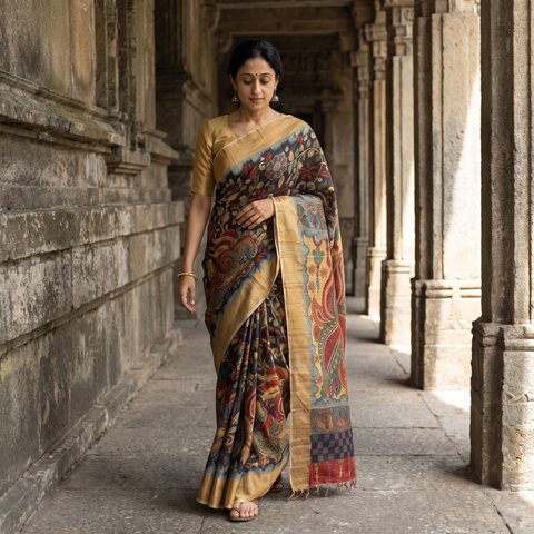 Black Pure Handloom Desi Tussar Silk Handpainted Srikalahasti Pen Kalamkari Saree with Zari Border, draped and worn by a woman, AI visual of the saree, iTokri