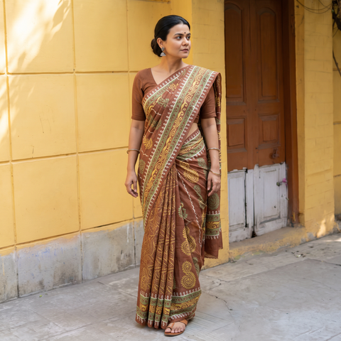 Brown Pure Handloom Tussar Silk Saree in Bengal Hand Block Prints, draped and worn by a woman, AI visual of the saree, iTokri