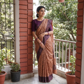 Orange Pure Handloom Tussar Silk Saree in Bengal Hand Block Prints, draped and worn by a woman, AI visual of the saree, iTokri