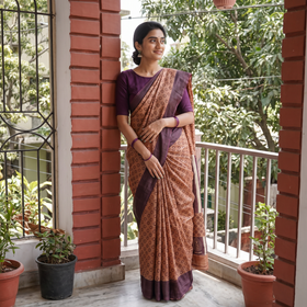 Orange Pure Handloom Tussar Silk Saree in Bengal Hand Block Prints, draped and worn by a woman, AI visual of the saree, iTokri