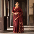 Maroon Pure Handloom Zari Buta Katan Silk Chanderi Saree, draped and worn by a woman, AI visual of the saree, iTokri