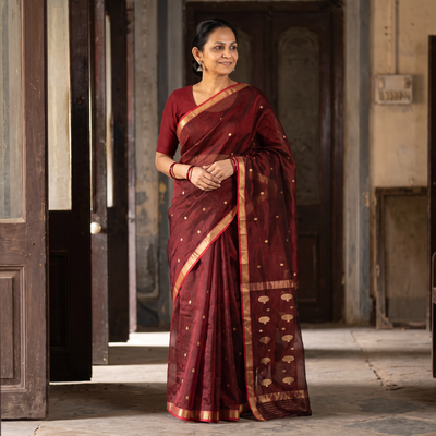 Maroon Pure Handloom Zari Buta Katan Silk Chanderi Saree, draped and worn by a woman, AI visual of the saree, iTokri