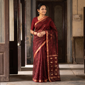 Maroon Pure Handloom Zari Buta Katan Silk Chanderi Saree, draped and worn by a woman, AI visual of the saree, iTokri