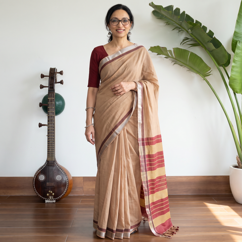 Beige Pure Handwoven Mangalagiri Cotton Saree with Zari Border, draped and worn by a woman, AI visual of the saree, iTokri