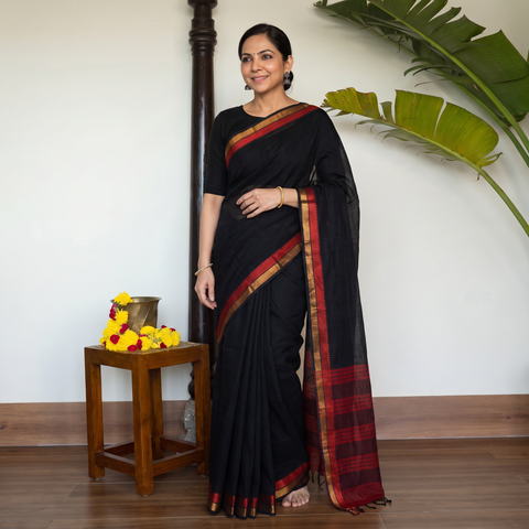 Black Pure Handwoven Mangalagiri Cotton Saree with Zari Border, draped and worn by a woman, AI visual of the saree, iTokri