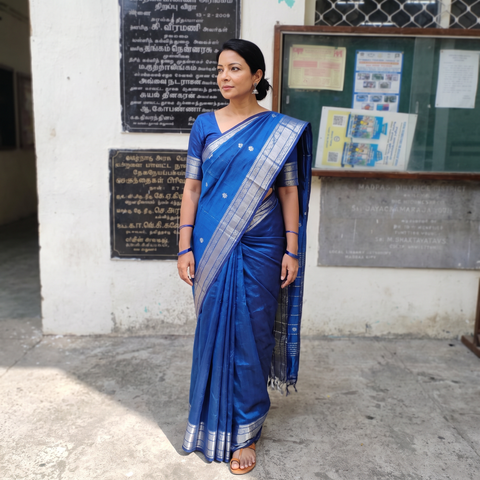 Blue Pure Handwoven Mangalagiri Silk Cotton Pattu Saree with Zari Border, draped and worn by a woman, AI visual of the saree, iTokri