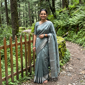 Green Pure Handwoven Mangalagiri Silk Cotton Pattu Saree with Zari Border, draped and worn by a woman, AI visual of the saree, iTokri