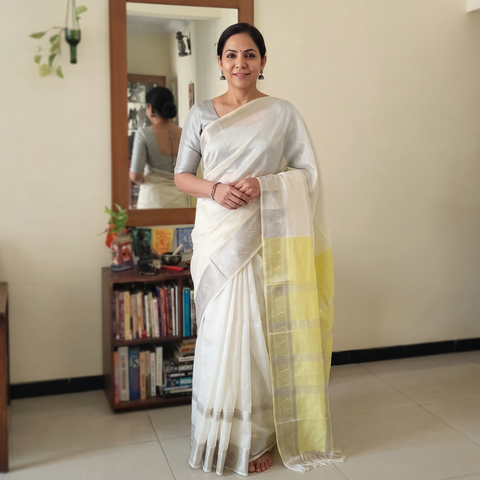 White Pure Handwoven Mangalagiri Silk Cotton Pattu Saree with Zari Border, draped and worn by a woman, AI visual of the saree, iTokri