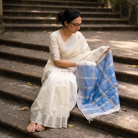 White Pure Handwoven Mangalagiri Silk Cotton Pattu Saree with Zari Border, draped and worn by a woman, AI visual of the saree, iTokri