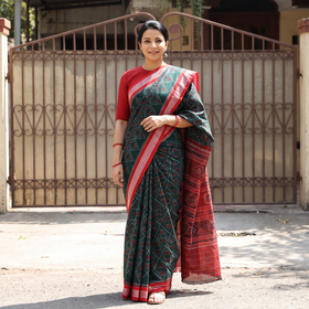 Green Pure Handwoven Sambalpuri Ikat Cotton Saree, draped and worn by a woman, AI visual of the saree, iTokri