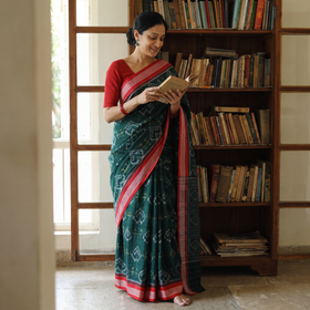 Green Pure Handwoven Sambalpuri Ikat Cotton Saree, draped and worn by a woman, AI visual of the saree, iTokri
