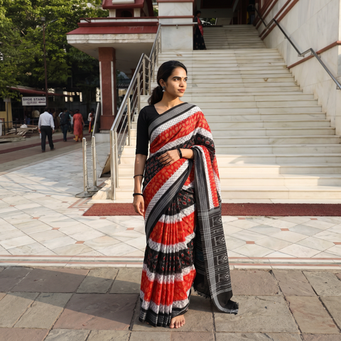 Black Pure Handwoven Sambalpuri Ikat Cotton Saree, draped and worn by a woman, AI visual of the saree, iTokri