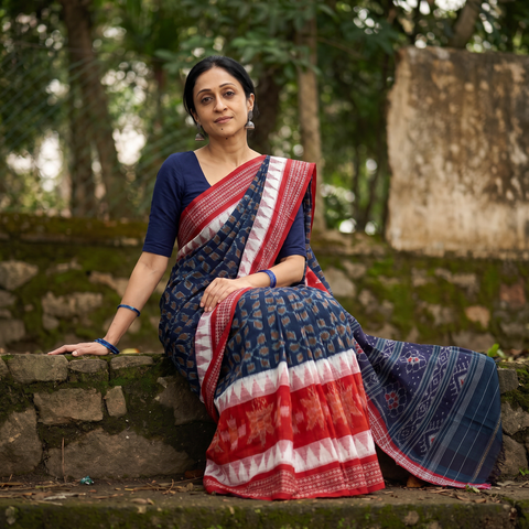 Red Pure Handwoven Sambalpuri Ikat Cotton Saree, draped and worn by a woman, AI visual of the saree, iTokri