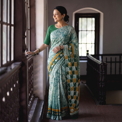 Green Pure Mul Cotton Hand Block Batik Print Saree, draped and worn by a woman, AI visual of the saree, iTokri