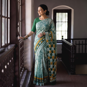 Green Pure Mul Cotton Hand Block Batik Print Saree, draped and worn by a woman, AI visual of the saree, iTokri