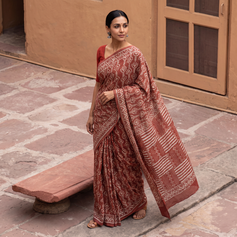 Brown Pure Mul Cotton Hand Block Batik Print Saree, draped and worn by a woman, AI visual of the saree, iTokri