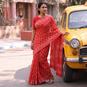 Red Pure Mul Cotton Hand Block Batik Print Saree, draped and worn by a woman, AI visual of the saree, iTokri