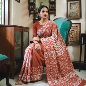 Brown Pure Mul Cotton Hand Block Batik Print Saree, draped and worn by a woman, AI visual of the saree, iTokri