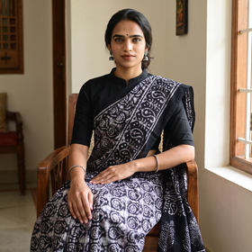 Black Pure Mul Cotton Hand Block Batik Print Saree, draped and worn by a woman, AI visual of the saree, iTokri