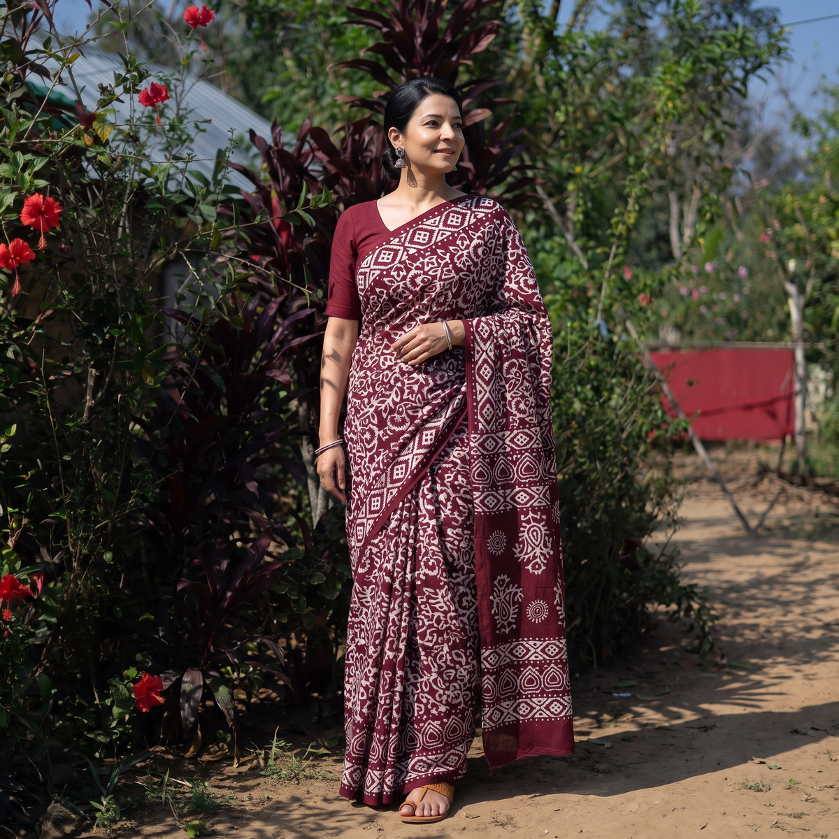 Maroon Pure Mul Cotton Hand Block Batik Print Saree, draped and worn by a woman, AI visual of the saree, iTokri