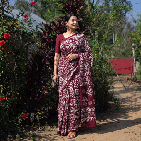 Maroon Pure Mul Cotton Hand Block Batik Print Saree, draped and worn by a woman, AI visual of the saree, iTokri