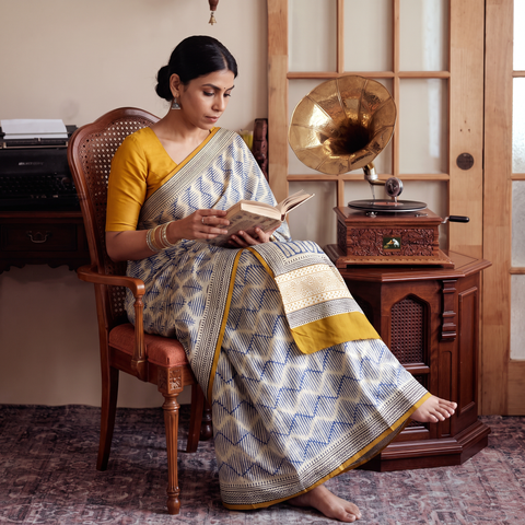 Beige Pure Mul Cotton Natural Dyed Hand Block Dabu Bagru Print Saree, draped and worn by a woman, AI visual of the saree, iTokri
