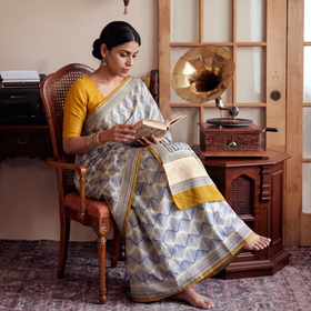 Beige Pure Mul Cotton Natural Dyed Hand Block Dabu Bagru Print Saree, draped and worn by a woman, AI visual of the saree, iTokri