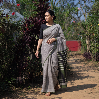 Black Pure Mul Cotton Natural Dyed Hand Block Dabu Bagru Print Saree, draped and worn by a woman, AI visual of the saree, iTokri