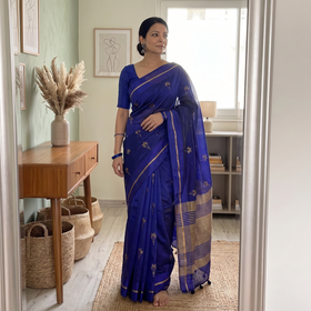 Blue Pure Silk Handloom Zari Buta Chanderi Pattu Saree, draped and worn by a woman, AI visual of the saree, iTokri