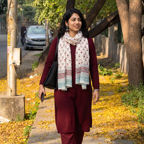 White Pure Wool Block Print Sanganeri Stole, worn by a woman, AI visual of the stole, iTokri