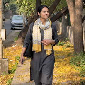 Yellow Pure Wool Hand Block Print Sanganeri Stole, worn by a woman, AI visual of the stole, iTokri