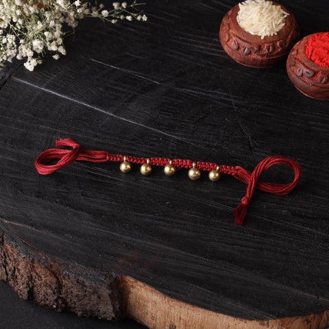 Handcrafted tribal dokra brass thread rakhi 13