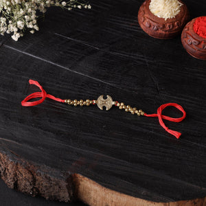 Handcrafted tribal dokra brass thread rakhi 17