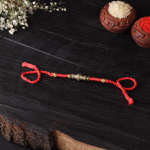 Handcrafted tribal dokra brass thread rakhi 20