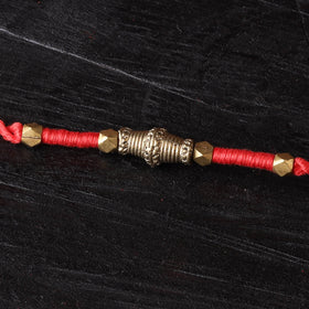 Handcrafted tribal dokra brass thread rakhi 20