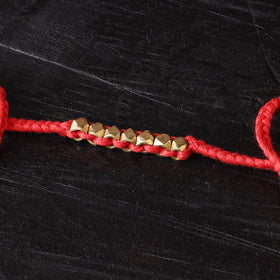 Handcrafted tribal dokra brass thread rakhi 22