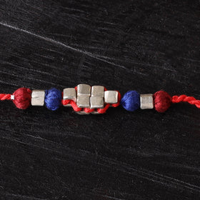 Handcrafted tribal dokra brass thread rakhi 40