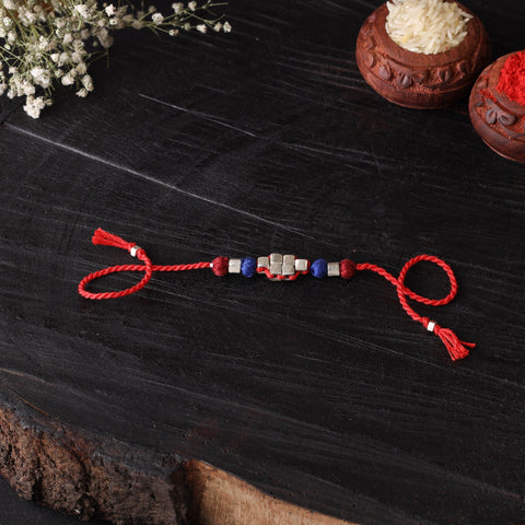 Handcrafted tribal dokra brass thread rakhi 40