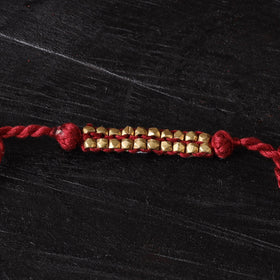 Handcrafted tribal dokra brass thread rakhi 43